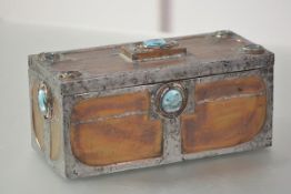 A copper veneered wooden casket in the Art Nouveau taste, of rectangular form with lift-off cover,