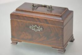 A George III inlaid mahogany tea caddy, of rectangular form, with caddy top and swing handle,