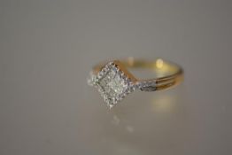 A diamond cluster ring, the pave-set plaque within diamond bands and diamond-set split shoulders, on