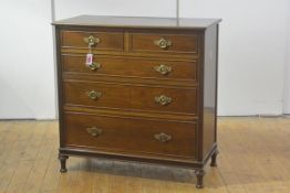An Edwardian mahogany chest of drawers, the rectangular moulded top above two short and three long