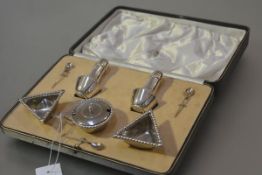 A George V cased silver "Traprain Treasure" condiment set, Brook Brothers, Edinburgh, the salts