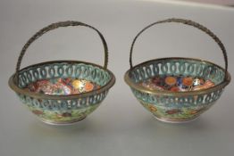 A pair of Samson of Paris gilt-metal mounted porcelain baskets, in the Imari palette, circular, each