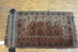 A Kurdish nomadic bag face rug, the centre with two rows of four medallions enclosed within a floral