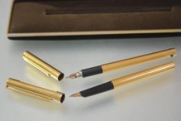 A S.T. Dupont silver-gilt fountain pen (vermeil), c. 1980, with part-fluted body, stamped marks