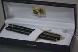 Caran d'Ache, a hexagonal fountain pen in black, c. 1990, cased with a Caran d'Ache roller