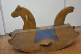 A naive painted pine rocking horse, early 20th century, possibly Scandinavian, the edges chip-