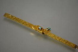 A striking Victorian diamond and turquoise-set gold panel link bracelet, c. 1870, centred by an