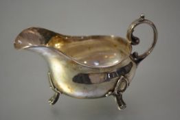 An Edwardian silver sauce boat, Atkin Bros., Sheffield 1905, in the Georgian taste, of bellied form,