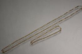 A 9ct gold fancy link necklace and bracelet en suite, each of elongated oval and circular links.