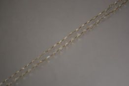 A moonstone chain necklace, the shaped moonstone cabochons collet-set and spaced by yellow metal