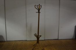 A beech hat and coat stand, c. 1900, unusually designed to stand flat against a wall, with reeded