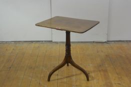 A Regency mahogany tripod table, the rectangular top with rounded corners, raised on a ring-turned