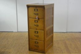 A Shannon golden oak four drawer filing cabinet, early 20th century, the drawers between reeded