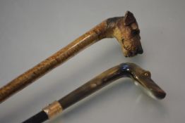 Two late 19th/early 20th century walking sticks, the handles modelled as hound's heads: the first