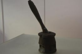 A West African carved wooden spice mortar and pestle, possibly Mali, the mortar with incised