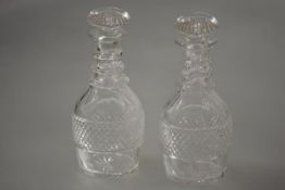 A pair of early 19th century cut-glass decanters, of mallet form, each with cut mushroom stopper