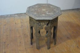 A striking painted octagonal table, probably Kashmir, late 19th century, the top polychrome