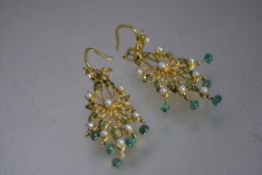 A pair of Indian emerald and pearl chandelier earrings, mounted in yellow metal, probably high carat