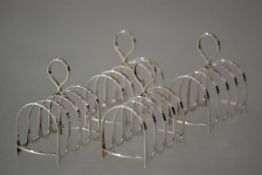 A set of four Edward VIII silver four-division toast racks, Cooper Brothers & Sons Ltd, Sheffield