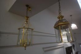 A 19thc style brass hanging lantern, 61cm x 28cm, together with a small brass hexagonal lantern (2)