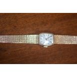 A lady's Tissot 9ct gold wristwatch and strap, total weight 22.1g