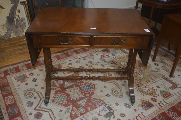 A 19thc style mahogany sofa table, the rectangular top above two frieze drawers on trestle base,