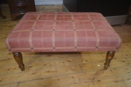 A rectangular upholstered footstool on turned legs, 40cm x 93cm x 62cm