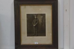 A WWI photograph of a trooper of The Lothian and Borders Yeomanry, in oak mount and frame, 66cm x