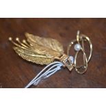 A lady's yellow metal fern leaf brooch and another brooch set with a pearl (2) total weight 10.8g