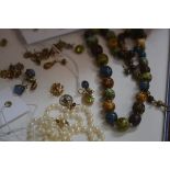 A mixed lot of jewellery including pearls, beads, earrings and a yellow metal tear drop shaped