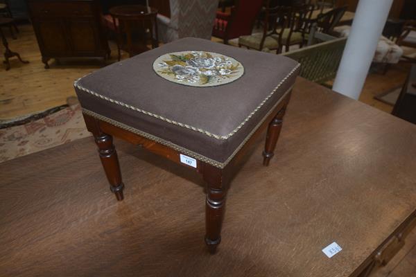 A 19thc mahogany footstool, the upholstered square top with bead work central panel, on plain frieze