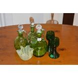 A mixed lot of coloured glass including oil bottles, glasses and a ribbon plate etc (a lot)