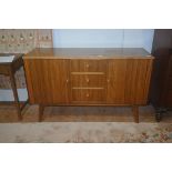 A vintage teak sideboard 'Cumbrae Furniture' by Morris of Glasgow, with plain top with moulded beech