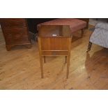 A vintage walnut work table, the hinged top enclosing lined interior, single frieze drawer on square