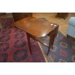 An Edwardian mahogany Sutherland table with crossbanded top