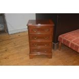 A 19thc style mahogany chest of drawers, the crossbanded top with moulded edge and canted corners,