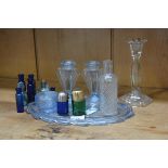 A mixed lot of glassware including a hallmarked silver topped green bottle, a pressed glass dressing