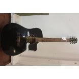 A Fender acoustic six string guitar