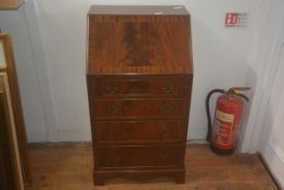 A 19thc style mahogany bureau, the plain top above crossbanded fall front, fitted interior, four