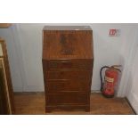 A 19thc style mahogany bureau, the plain top above crossbanded fall front, fitted interior, four