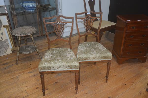 A pair of Edwardian inlaid rosewood bedroom chairs with upholstered seats