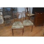 A pair of Edwardian inlaid rosewood bedroom chairs with upholstered seats