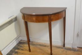 An Edwardian mahogany demi lune side table, the top with moulded edge and inlaid frieze on inlaid sq