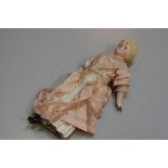 A 19thc bisque head doll with stuffed body, bisque hands, arms and feet (h.30cm), £30-40