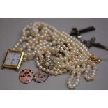 Two enamelled portrait panels, two crucifixes, a paste pearl necklace with cultured pearl, white met