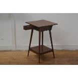 An Edwardian cherrywood writing table, the square top with moulded edge, with pull out inkwell and p