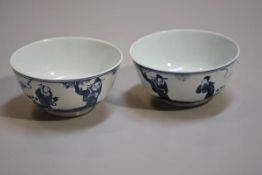 A pair of Chinese Republic porcelain underglazed blue and white bowls depicting Immortals (h. 5.5cm