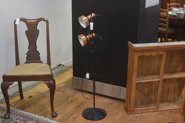 A 1970s black anodised metal twin copper shaded adjustable floor spotlamp on circular moulded base (