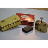 The Union Bank of Manchester oval brass savings bank complete with key, a miniature book box, a ciga