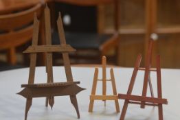 A group of three treen easels including a Bavarian style easel (tallest 29cm), £20-40